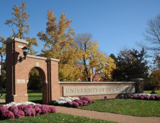 university of mount union sign with brick arch and autumn trees