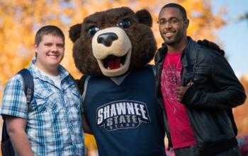 two students with a shawnee state mascot