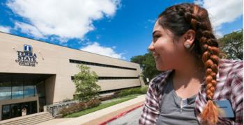 student smiling outside terra state community college building