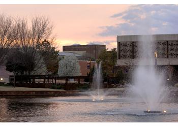 sunset view over campus with water fountains