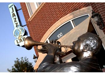 statue of musician with trumpet