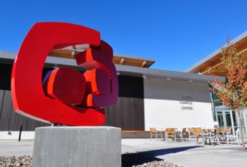 Central Oregon Community College campus building and statue