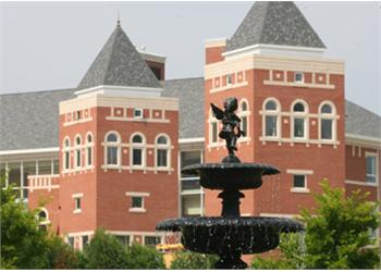 campus building with red bricks and fountain
