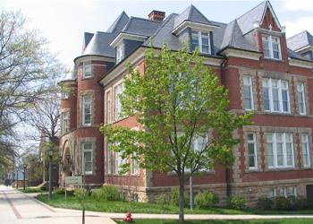 traditional brick building with large windows