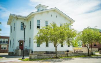 historic white building with greenery