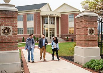 three students walking by the lyn science center