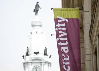 banner with 'creativity' text and clock tower