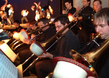 musicians in orchestra playing trombones