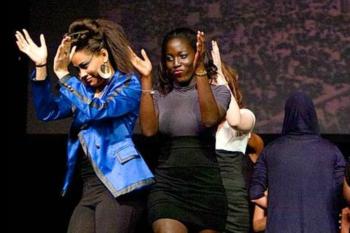 students performing a dance on stage