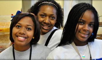 three students with badges