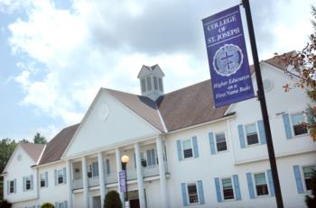 college of st. joseph' sign with campus building