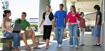 students walking and chatting on campus
