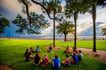 outdoor group meeting on campus lawn