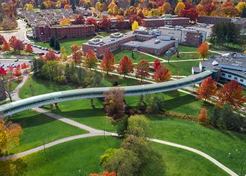 Aerial view of the Edinboro campus with colorful autumn trees.