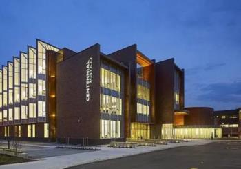modern building with 'centennial college' sign on brick facade